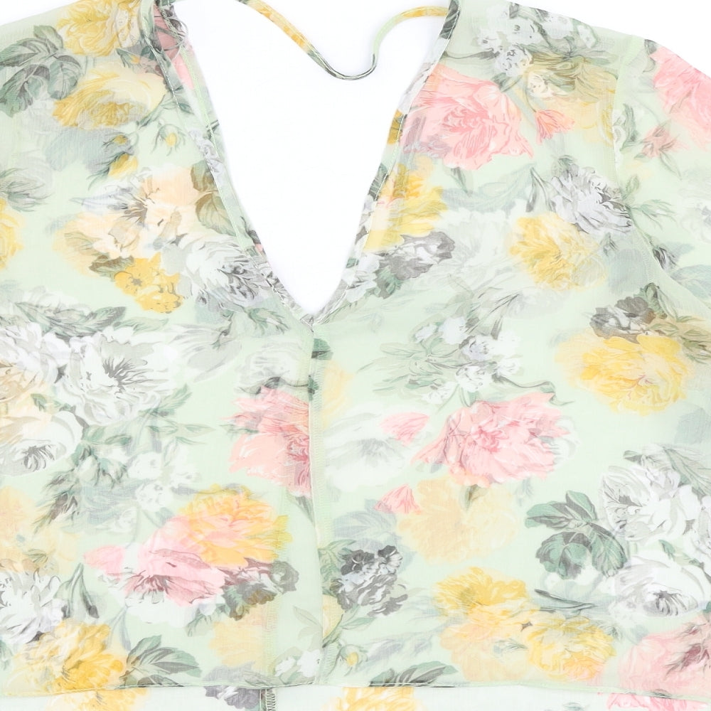 Brand and care label for Miss Selfridge women’s green floral polyester basic blouse, size UK 12, v-neck