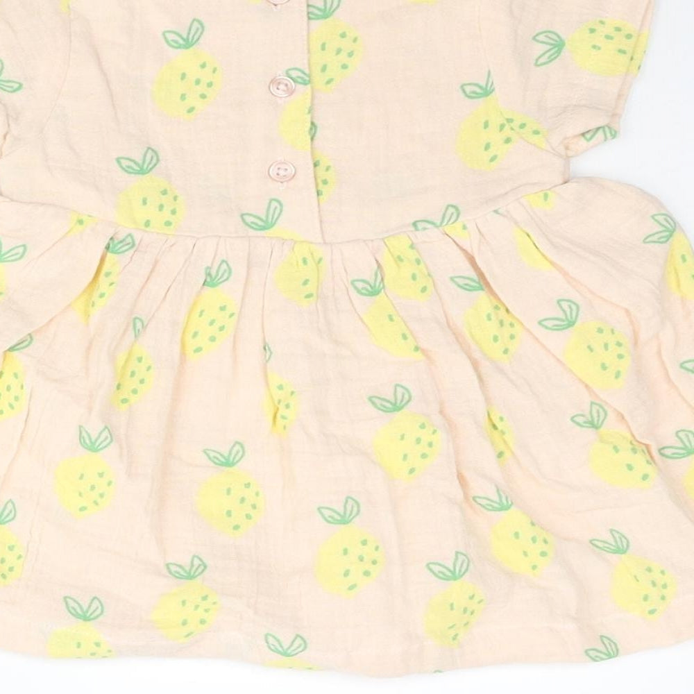 Brand and care label for Marks & Spencer girls’ pink geometric cotton a-line, size 3-6, months round neck button - pinapple