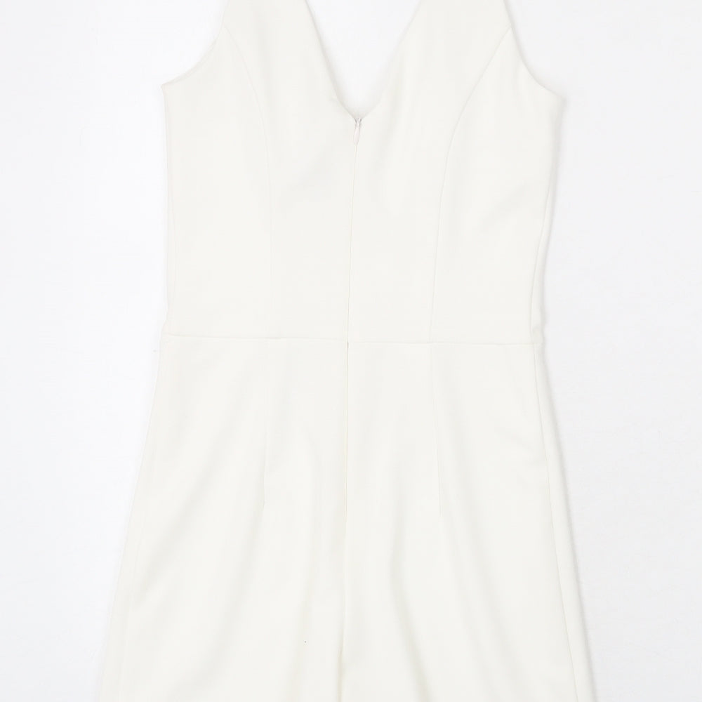 Brand and care label for Miss Selfridge women’s white polyester romper one-piece, size UK 6, zip - chain strap