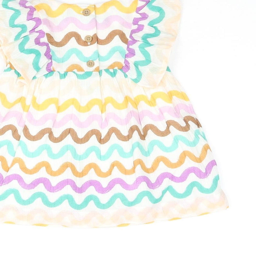 Brand and care label for Marks & Spencer girls’ multicoloured geometric cotton a-line, size 0-3, months round neck button