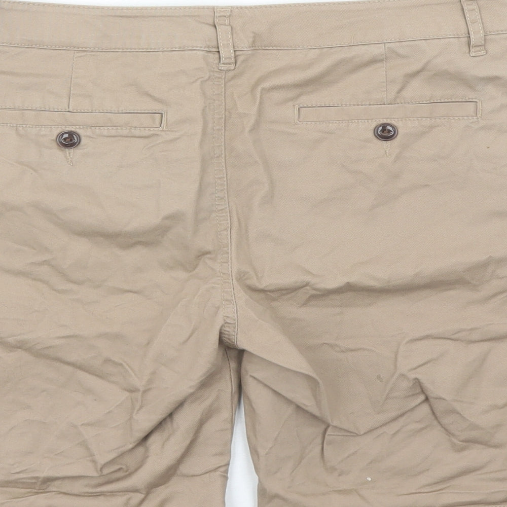 Brand and care label for ASOS men’s brown cotton bermuda shorts, size 28, in, 7-inch leg regular zip