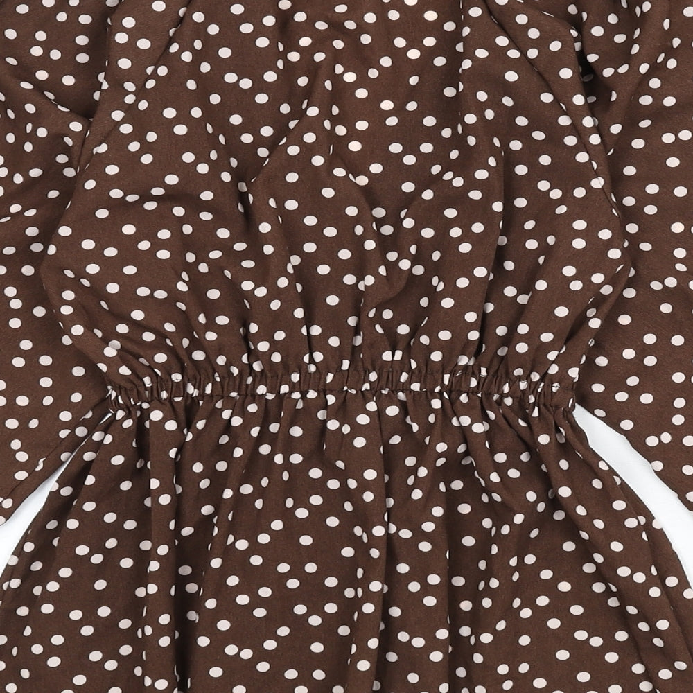 Brand and care label for ASOS women’s brown polka dot polyester basic blouse, size UK 4, v-neck - balloon sleeves