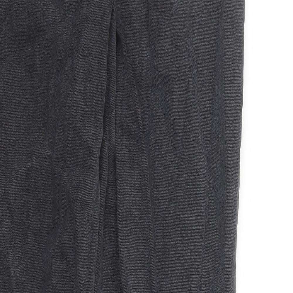 Brand and care label for NA-KD women’s black polyester straight jeans, size UK 26, in, 30-inch leg regular zip