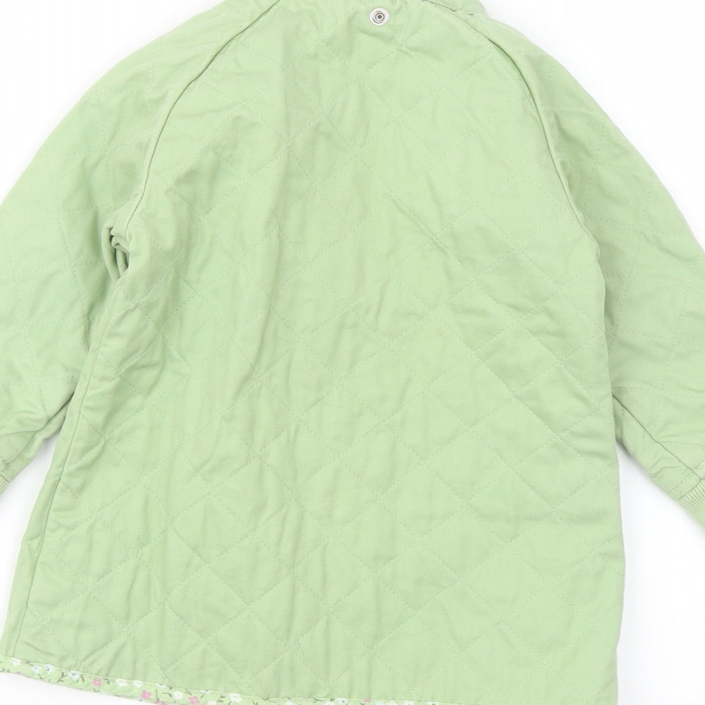 Brand and care label for Gap girls’ green jacket, size 3, years zip