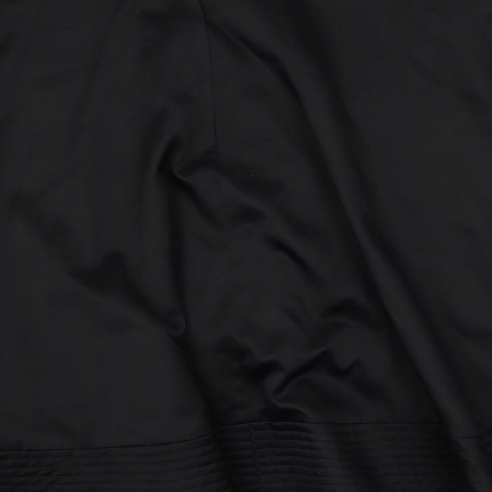 Brand and care label for H7M women’s black polyester flare skirt, size UK 8, button