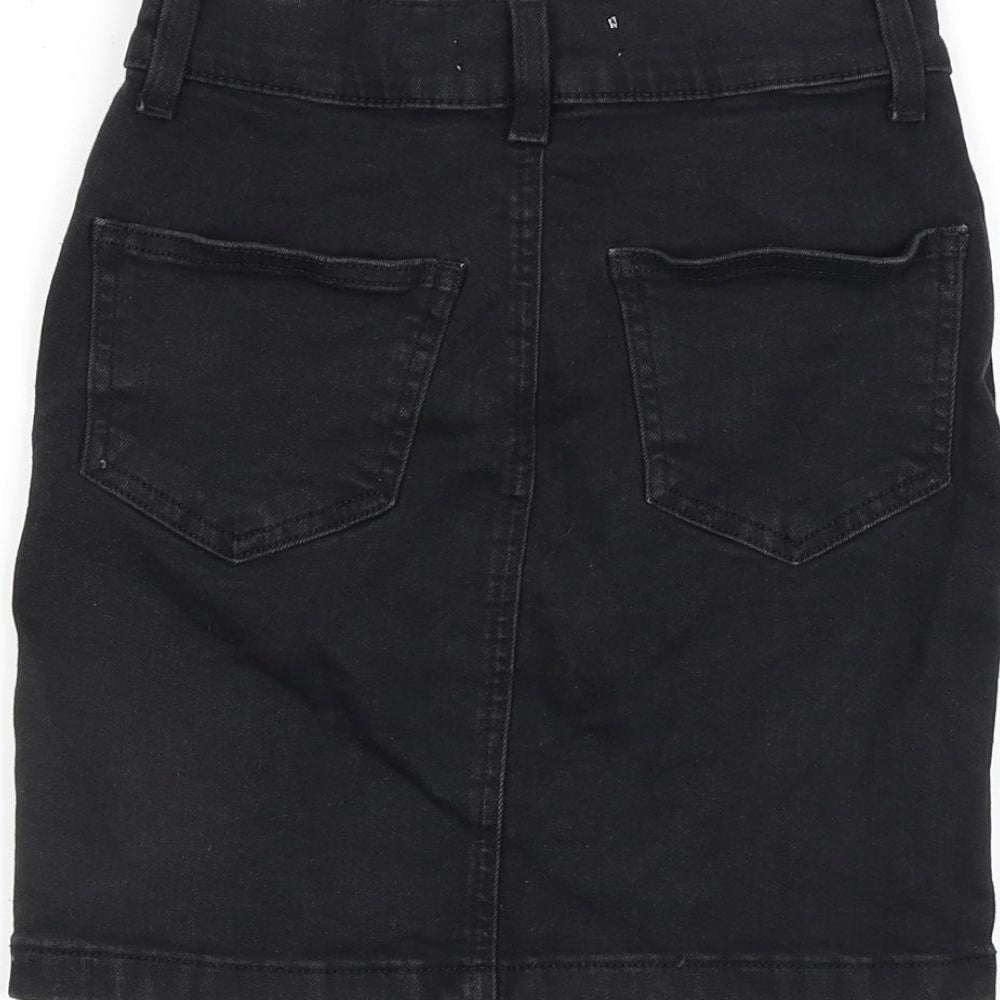 Brand and care label for Denim & Co. women’s black cotton a-line skirt, size UK 4, zip