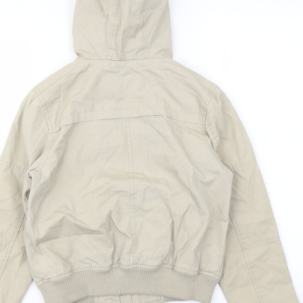Brand and care label for Indigo girls’ beige jacket, size 9-10, years zip