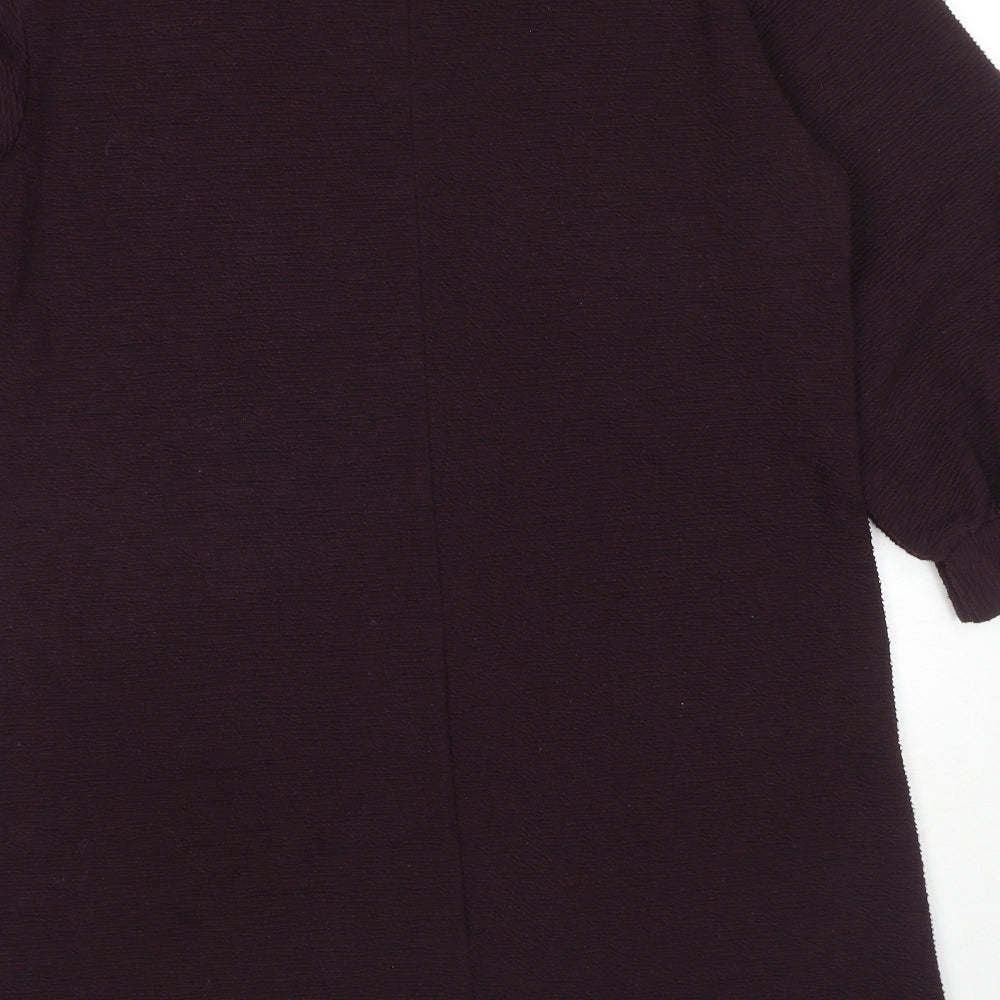 Brand and care label for French Connection women’s purple polyester jumper dress, size UK 10, round neck pullover