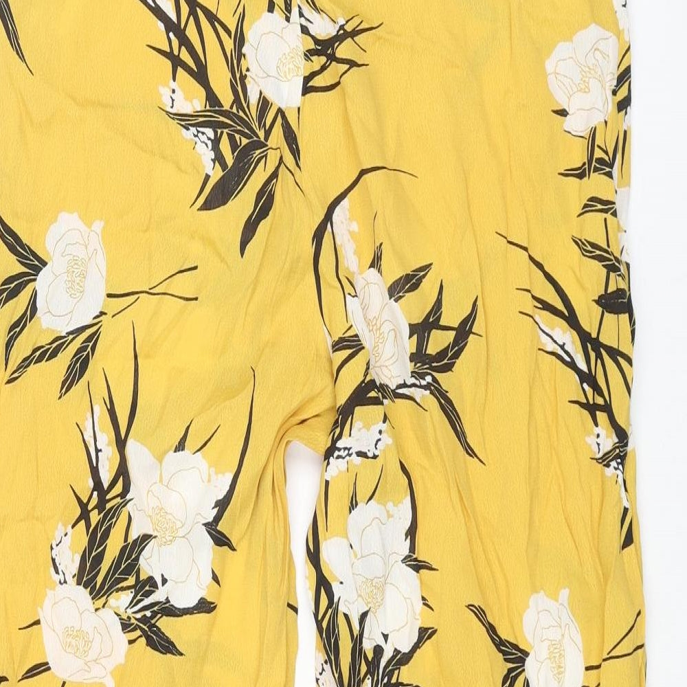 Brand and care label for Miss Selfridge women’s yellow floral viscose cropped trousers, size UK 8, 23-inch leg regular zip