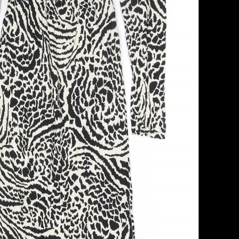 Brand and care label for Miss Selfridge women’s black viscose a-line, size UK 4, off the shoulder pullover - side slit(s)
