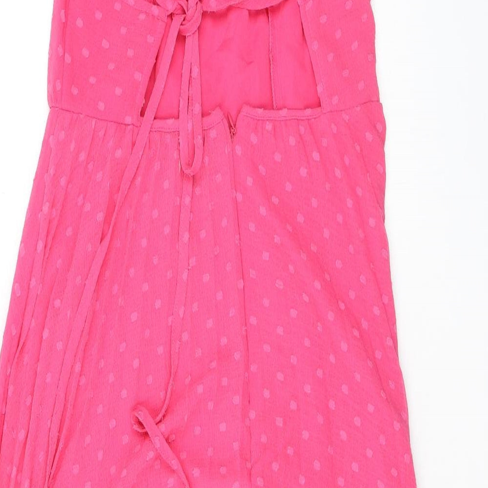 Brand and care label for ASOS women’s pink polka dot polyester a-line, size UK 10, halter zip - open back