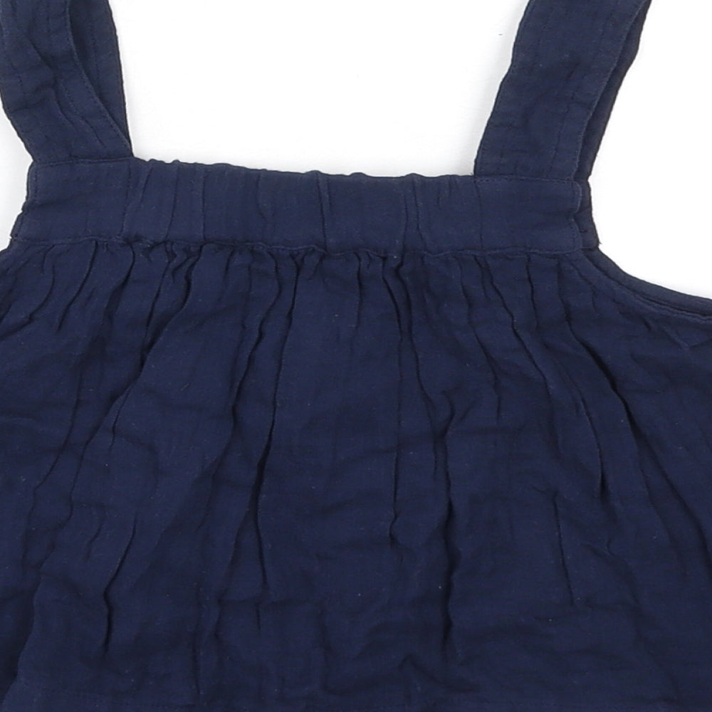 Brand and care label for Marks & Spencer girls’ blue cotton basic tank, size 7-8, years square neck pullover