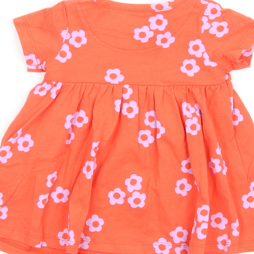 Brand and care label for Marks & Spencer girls’ orange floral cotton fit & flare, size 0-3, months round neck snap