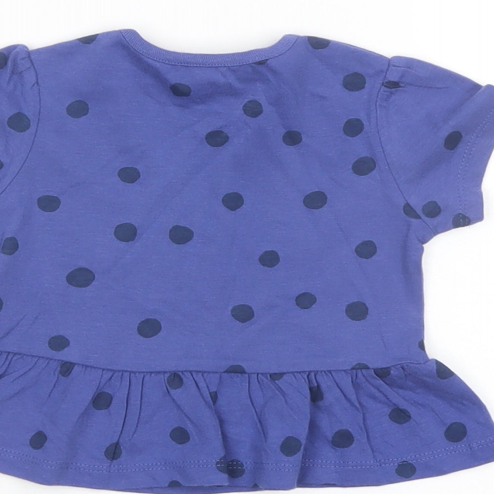 Brand and care label for Marks & Spencer girls’ blue polka dot cotton basic t-shirt, size 6-9, months crew neck snap