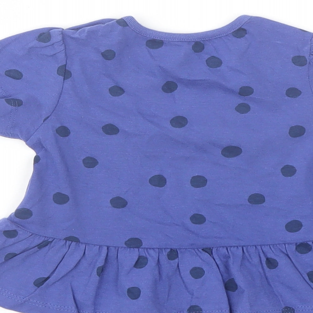 Brand and care label for Marks & Spencer girls’ pink polka dot cotton basic t-shirt, size 6-9, months crew neck snap