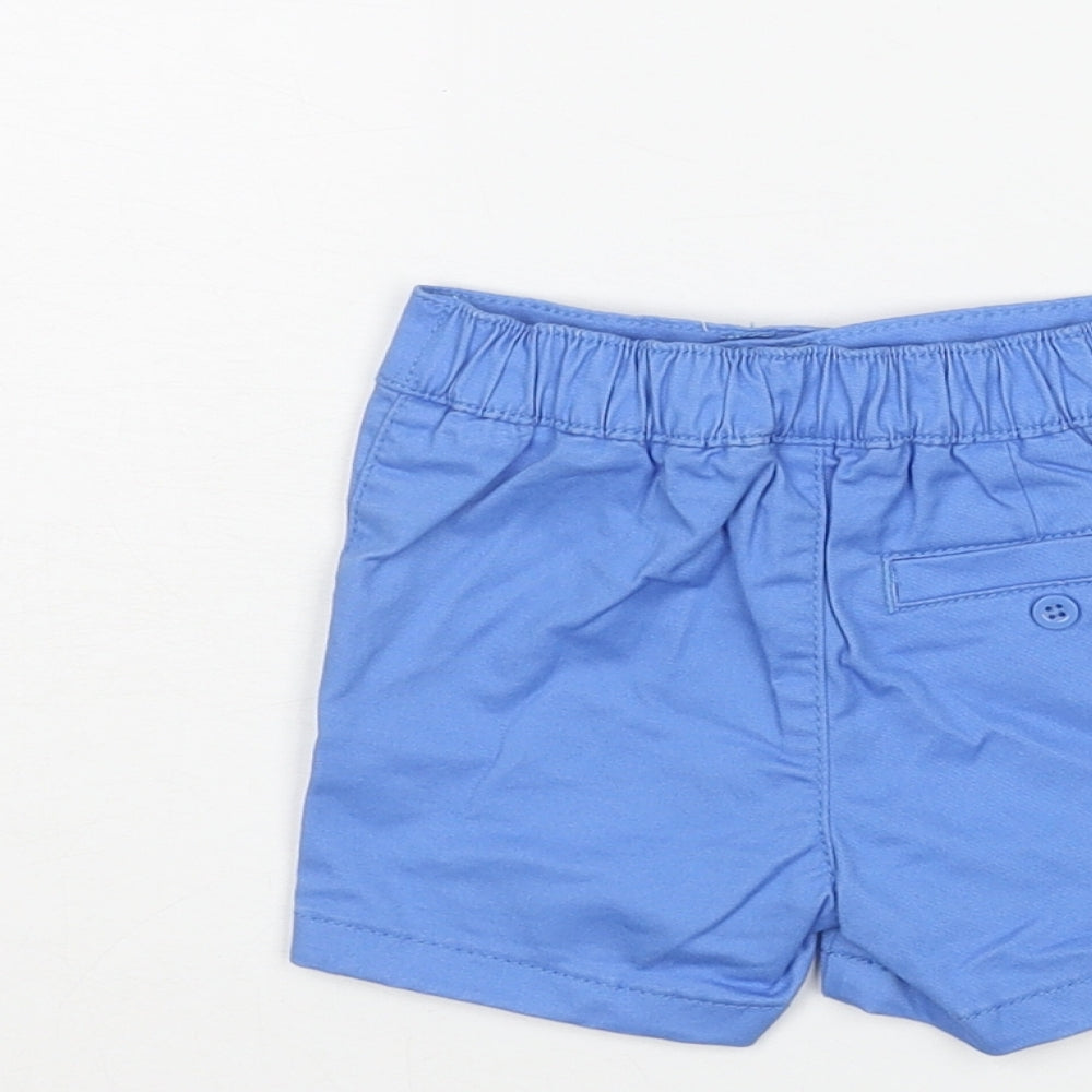 Brand and care label for Marks & Spencer boys’ blue cotton cropped trousers, size 0-3, months button