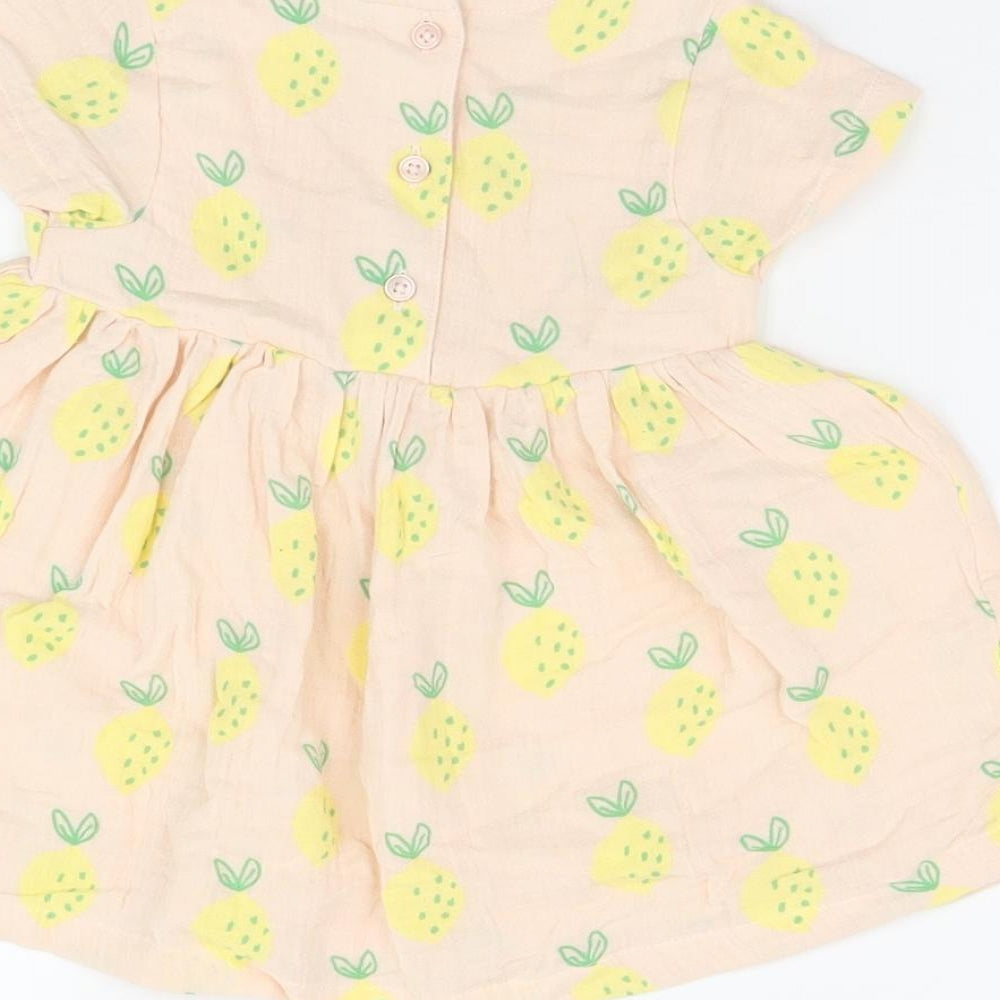 Brand and care label for Marks & Spencer girls’ pink geometric cotton a-line, months round neck button - lemon print