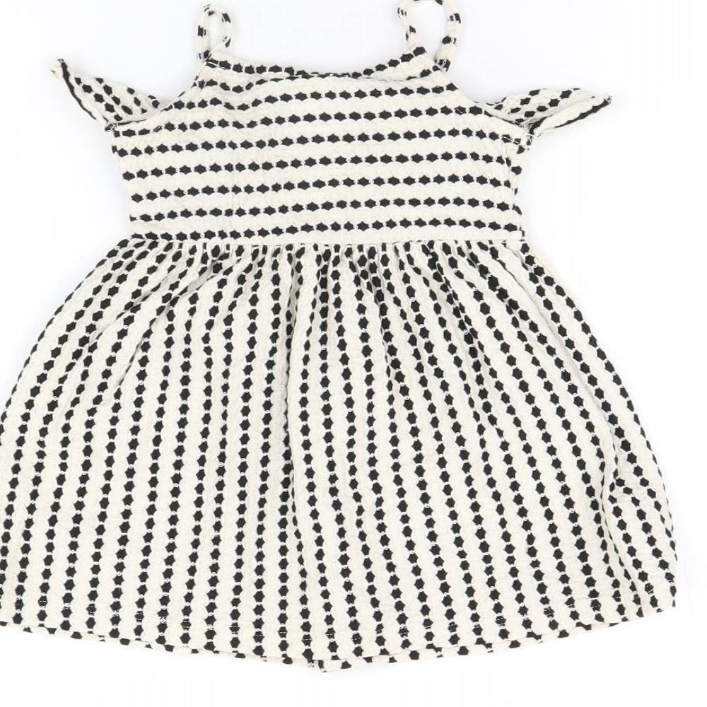 Brand and care label for Zara girls’ white striped cotton a-line, size 12-18, months scoop neck pullover