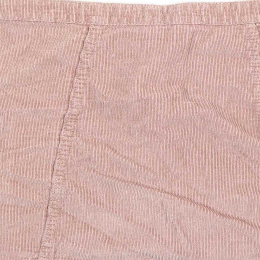 Brand and care label for Denim & Co. women’s pink cotton mini skirt, size UK 10, button