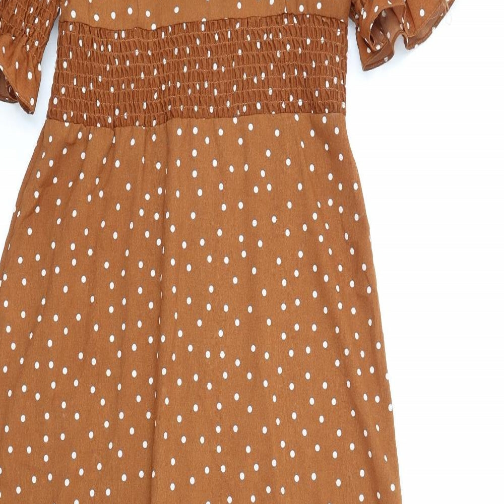 Brand and care label for ASOS women’s brown polka dot polyester a-line, size UK 8, v-neck button