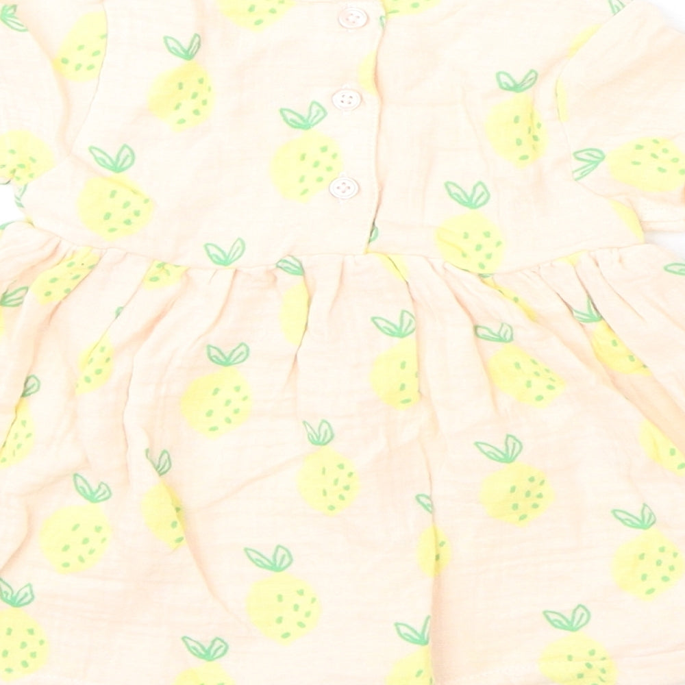 Brand and care label for Marks & Spencer girls’ pink geometric 100% cotton a-line, months round neck button - lemons