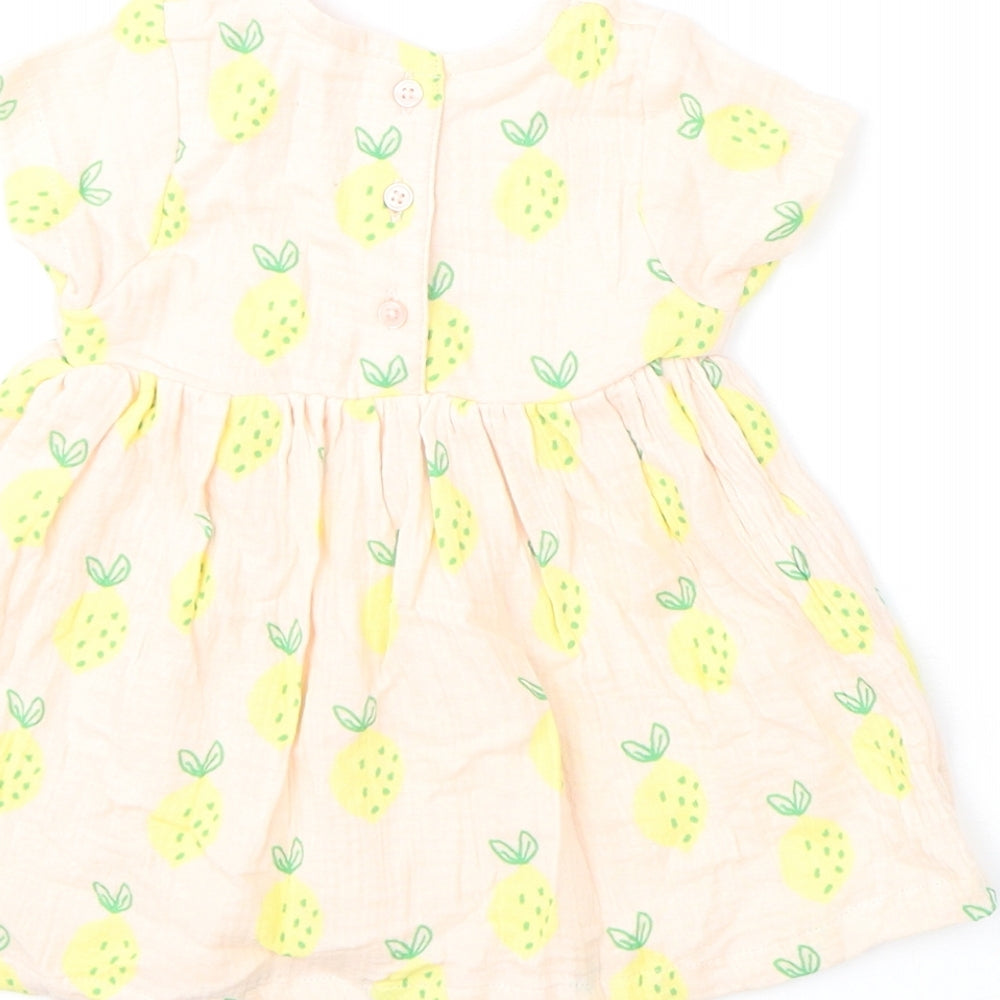 Brand and care label for Marks & Spencer girls’ pink geometric cotton a-line, size 3-6, months round neck button - lemons