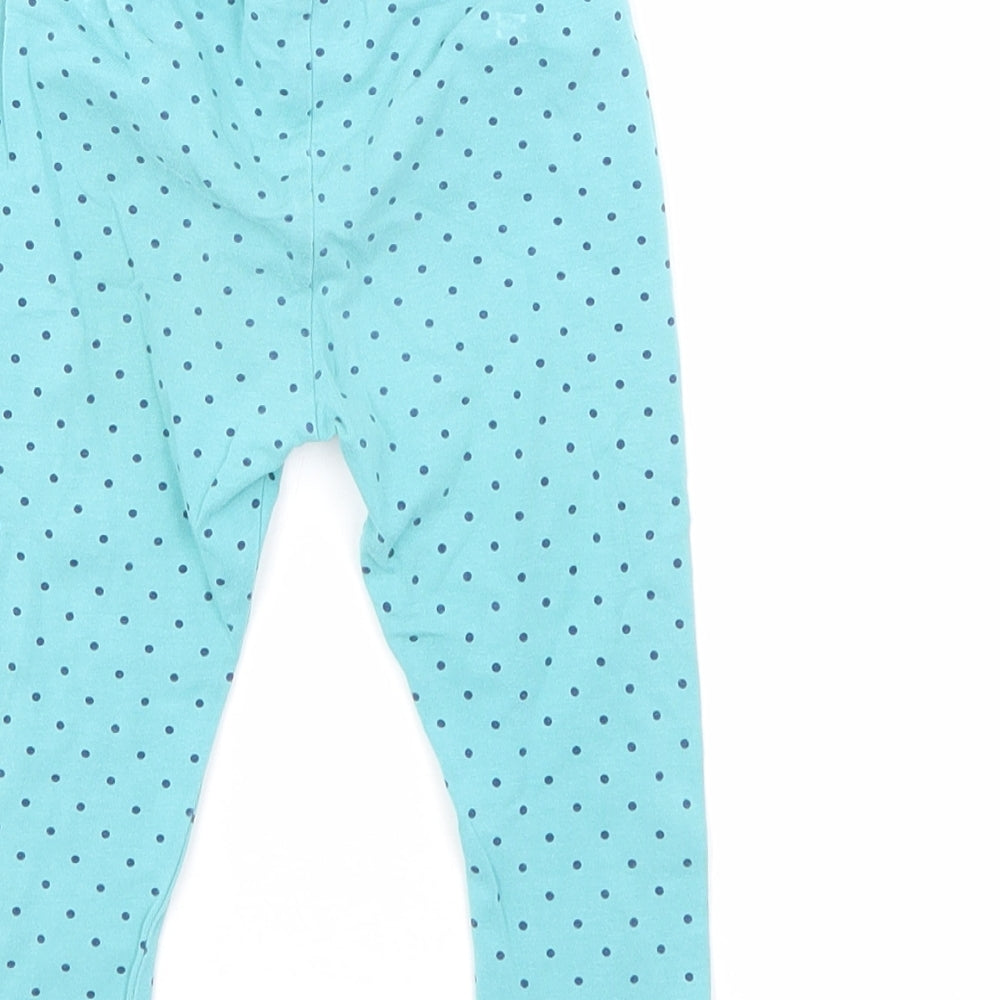 Brand and care label for Mini Club girls’ blue polka dot cotton pedal pusher leggings, size 12-18, months