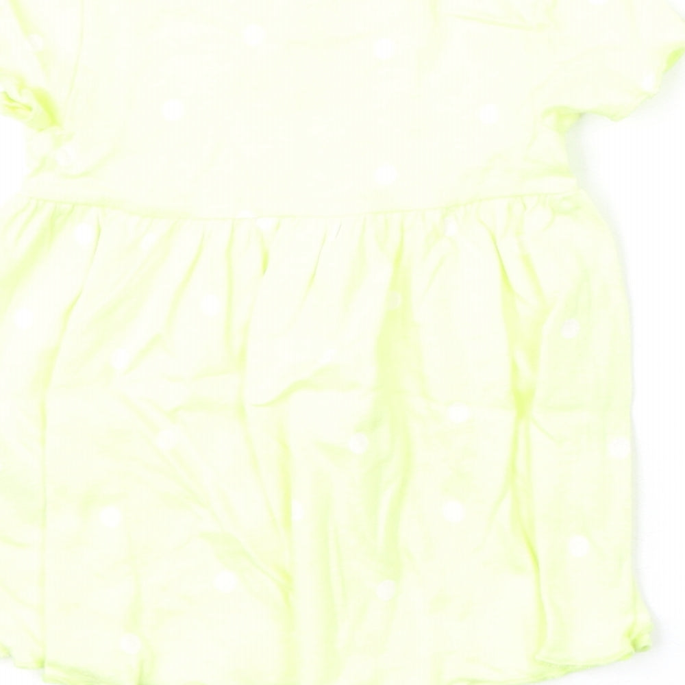 Brand and care label for Marks & Spencer girls’ yellow polka dot cotton a-line, size 0-3, months round neck snap