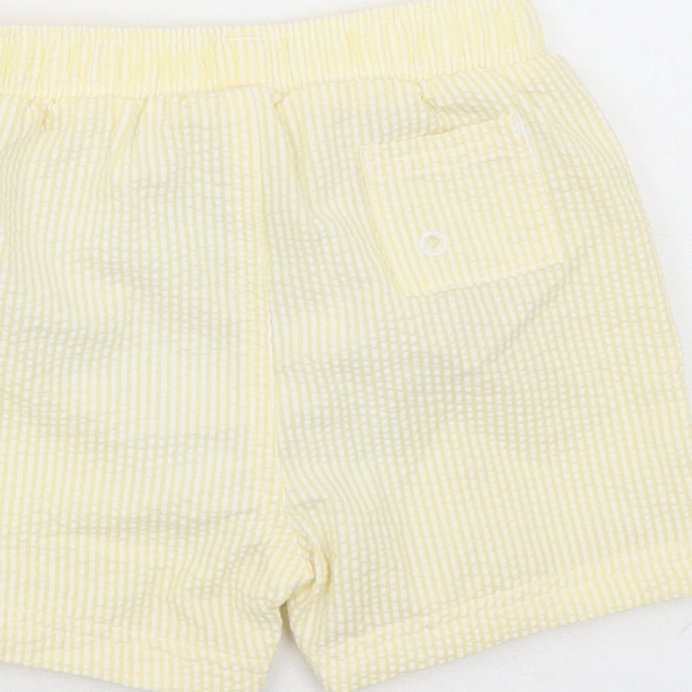 Brand and care label for Marks & Spencer boys’ yellow striped cotton sweatpants, months - elasticated waist swim shorts