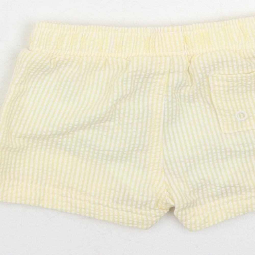 Brand and care label for Marks & Spencer boys’ yellow striped cotton sweatpants, months - elasticated waist swim shorts