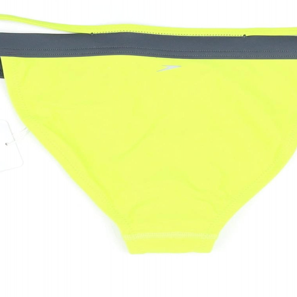 Brand and care label for Speedo women’s yellow polyamide swim bottom, size M