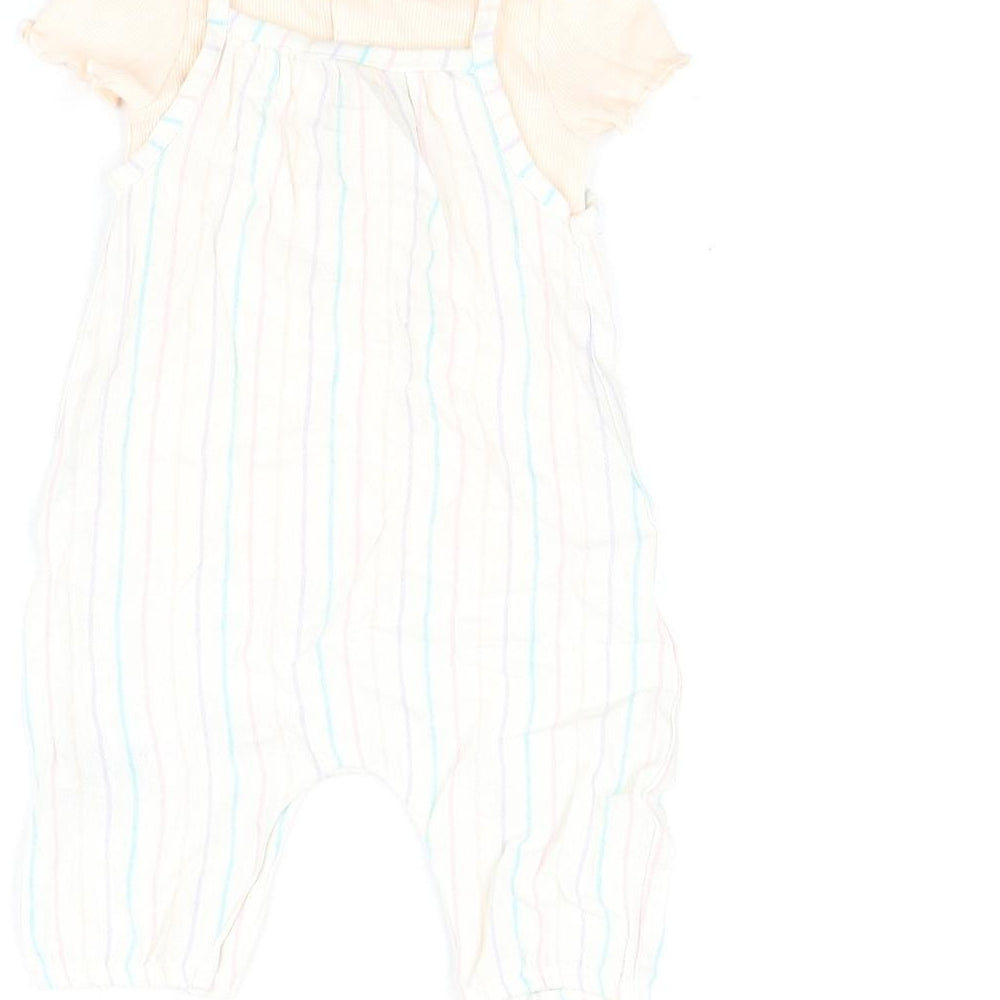 Brand and care label for Marks & Spencer girls’ pink striped viscose dungaree outfit/set, size 0-3, months button