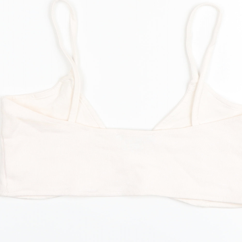 Brand and care label for Missguided women’s pink polyester cropped tank, size UK 12, v-neck