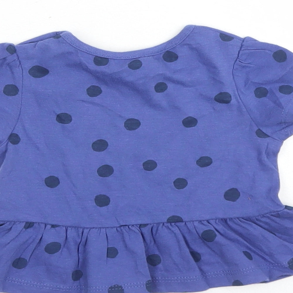 Brand and care label for Marks & Spencer girls’ blue polka dot 100% cotton basic t-shirt, size 0-3, months round neck snap
