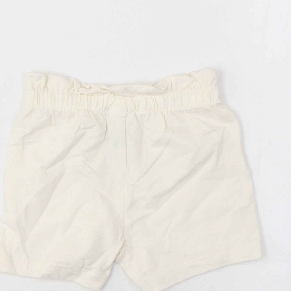 Brand and care label for Marks & Spencer girls’ ivory cotton cropped trousers, size 3-6, months pullover - lemon