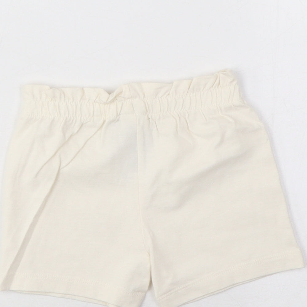 Brand and care label for Marks & Spencer girls’ beige cotton cropped trousers, size 3-6, months pullover - lemon