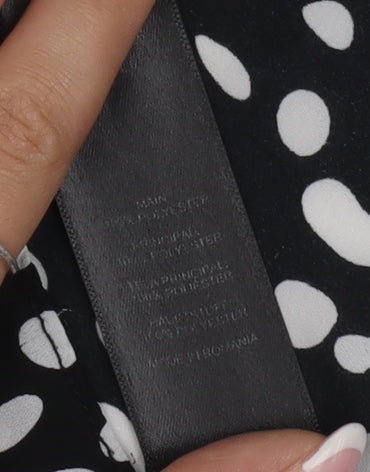 Brand and care label for ASOS Women's Black & White Polka Dot Halter Tank