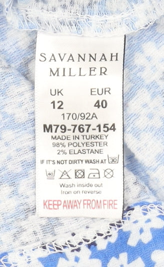 Brand and care label for Savannah Miller Blue Floral Tunic Blouse, size 12