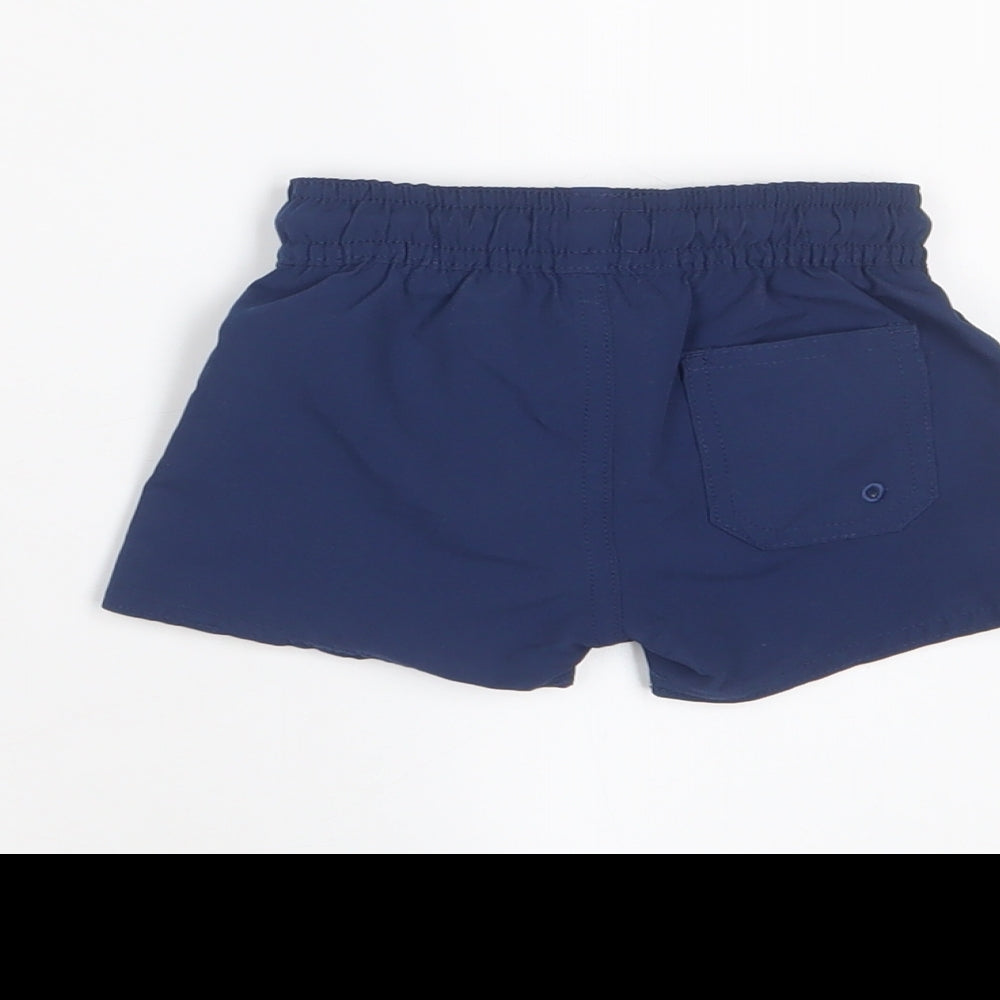 Brand and care label for Marks & Spencer boys’ blue polyester cropped trousers, size 0-3, months drawstring - swim shorts