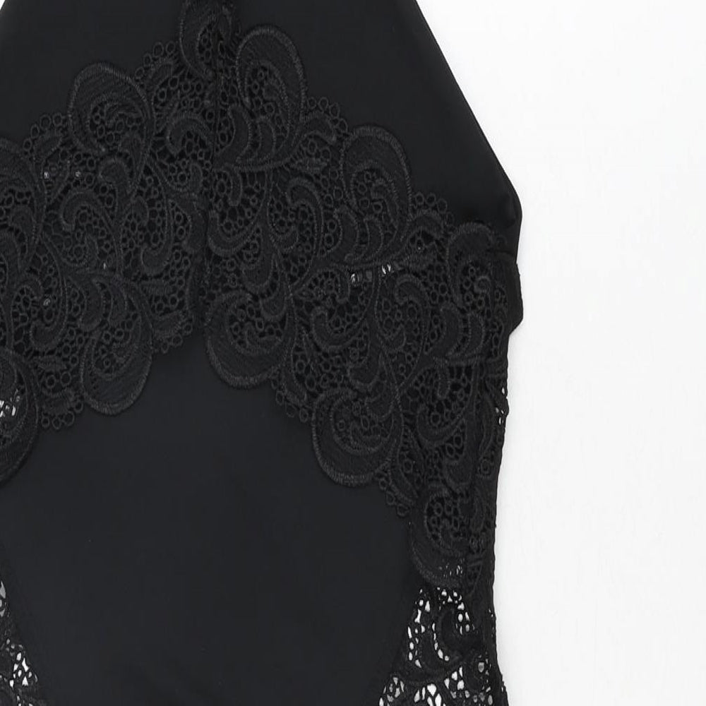 Brand and care label for Missguided women’s black polyester bodysuit one-piece, size UK 10, snap