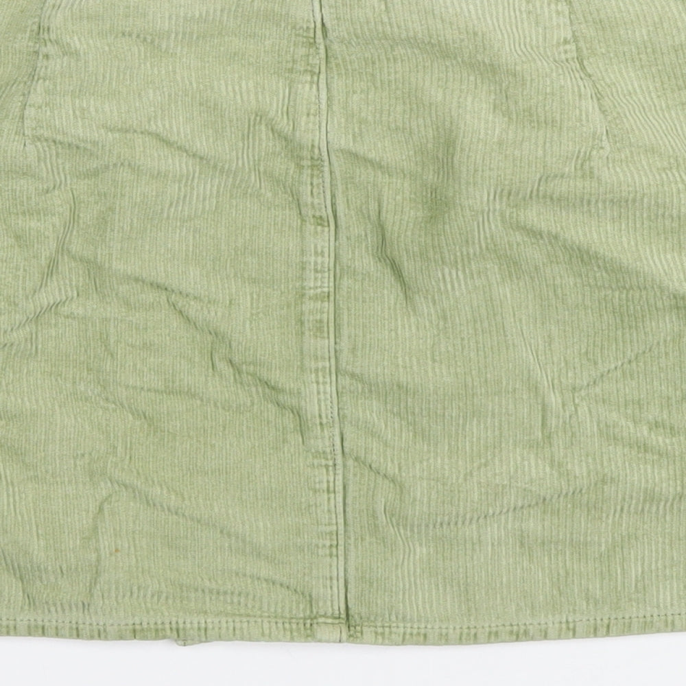 Brand and care label for ASOS women’s green cotton a-line skirt, size UK 16, zip