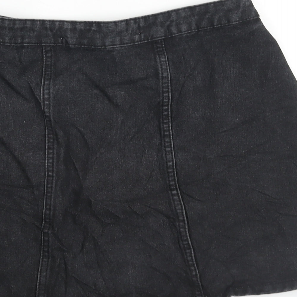 Brand and care label for Denim & Co. women’s black cotton a-line skirt, size UK 8, zip