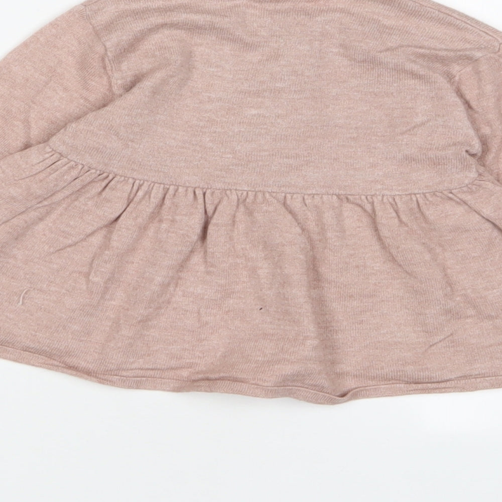 Brand and care label for Zara girls’ purple polyester pinafore/dungaree dress, size 12-18, months crew neck button