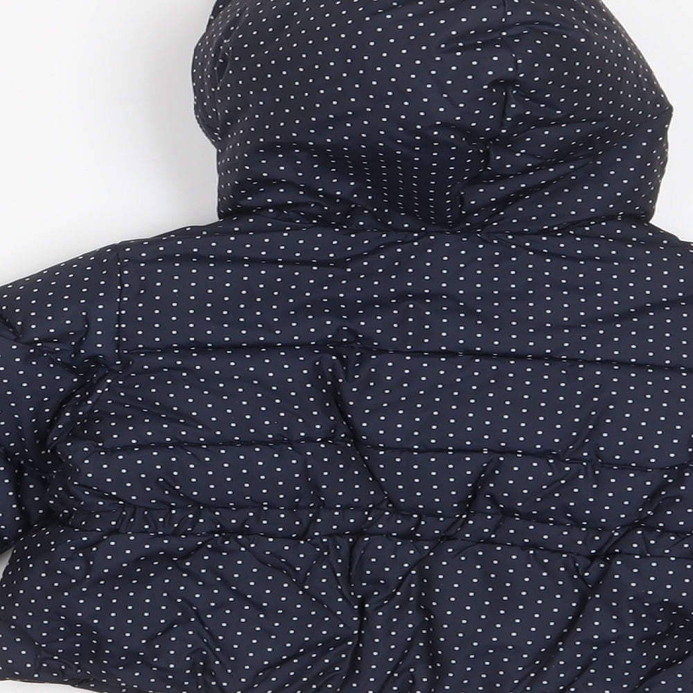 Brand and care label for Gap girls’ blue polka dot biker coat, size 3-6, months button