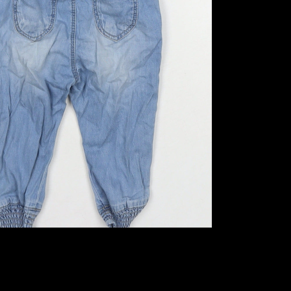 Brand and care label for Zara girls’ blue cotton jogger jeans, size 6-9, months pullover