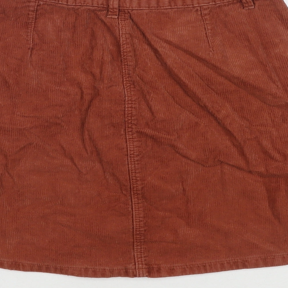 Brand and care label for Sfera women’s brown cotton a-line skirt, size M, button