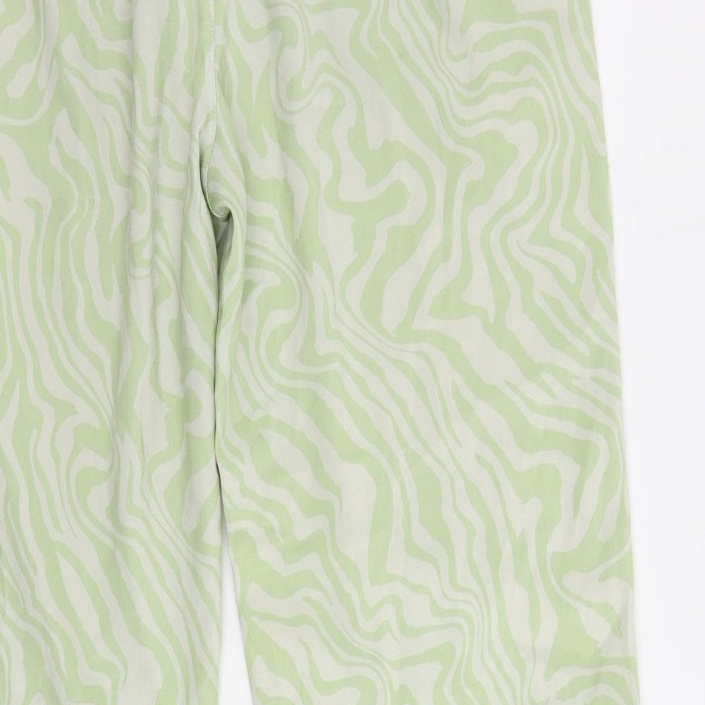 Brand and care label for ASOS women’s green animal print polyester trousers, size UK 10 regular drawstring - adjustable waist