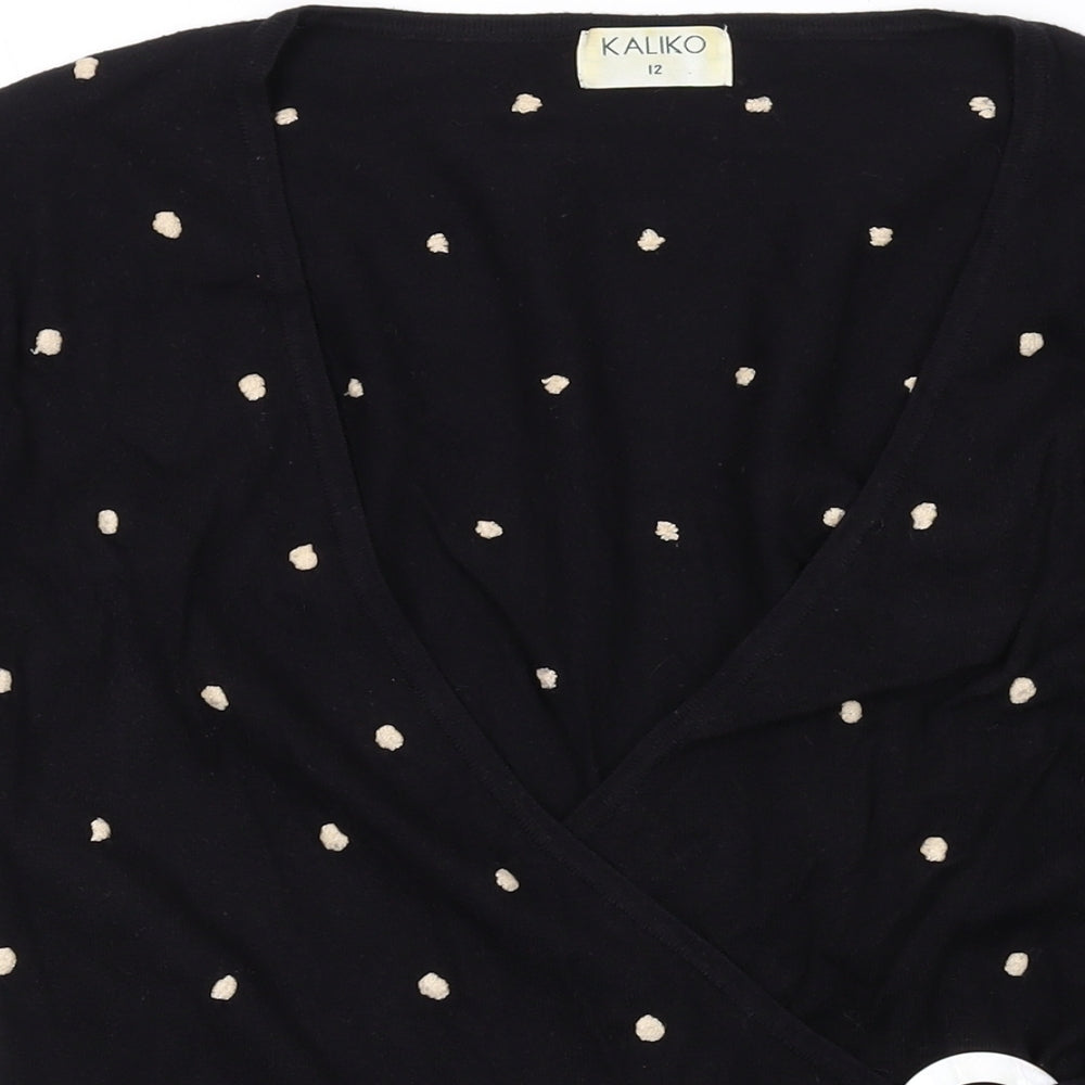 Brand and care label for Kaliko women’s black v-neck polka dot viscose wrap jumper, size UK 12