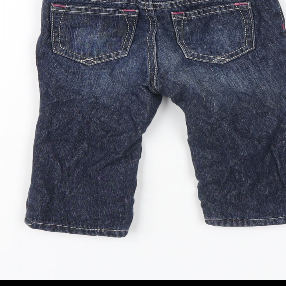 Brand and care label for Gap girls’ blue cotton capri jeans, size 6-9, months snap