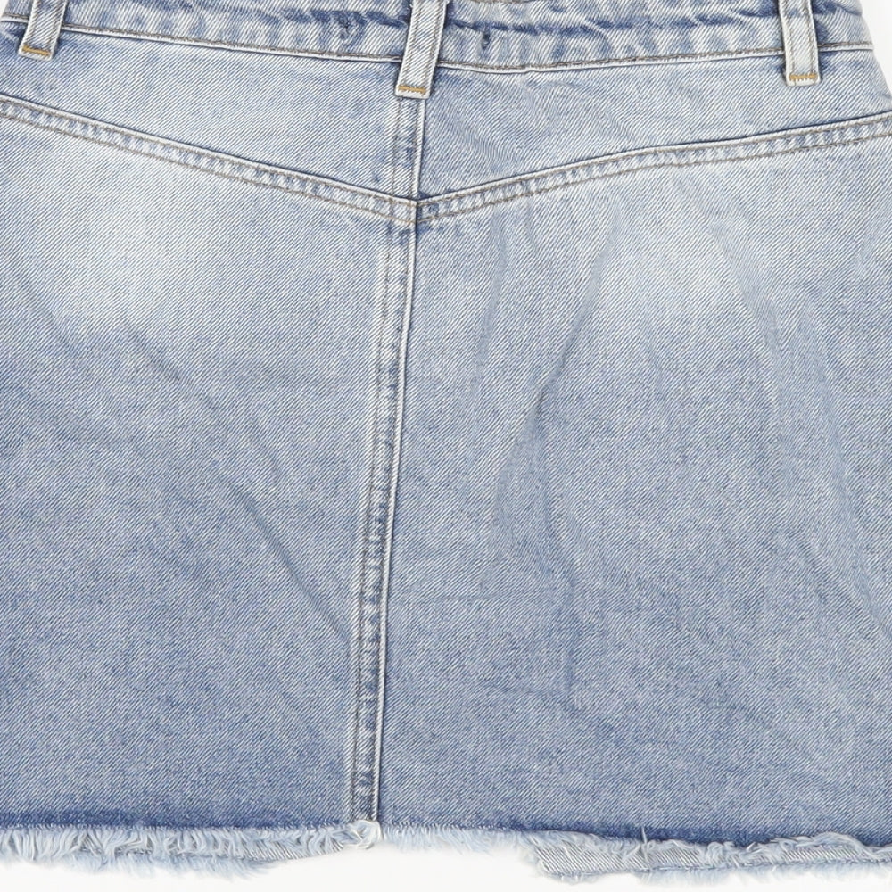 Brand and care label for Missguided women’s blue cotton a-line skirt, size UK 6, zip